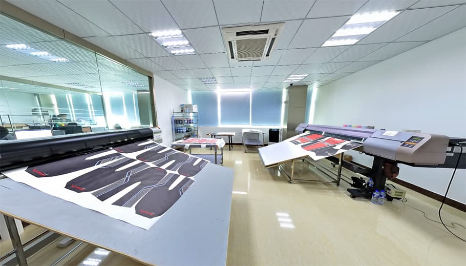 Printed activewear garment panels being prepared in a factory printing workspace