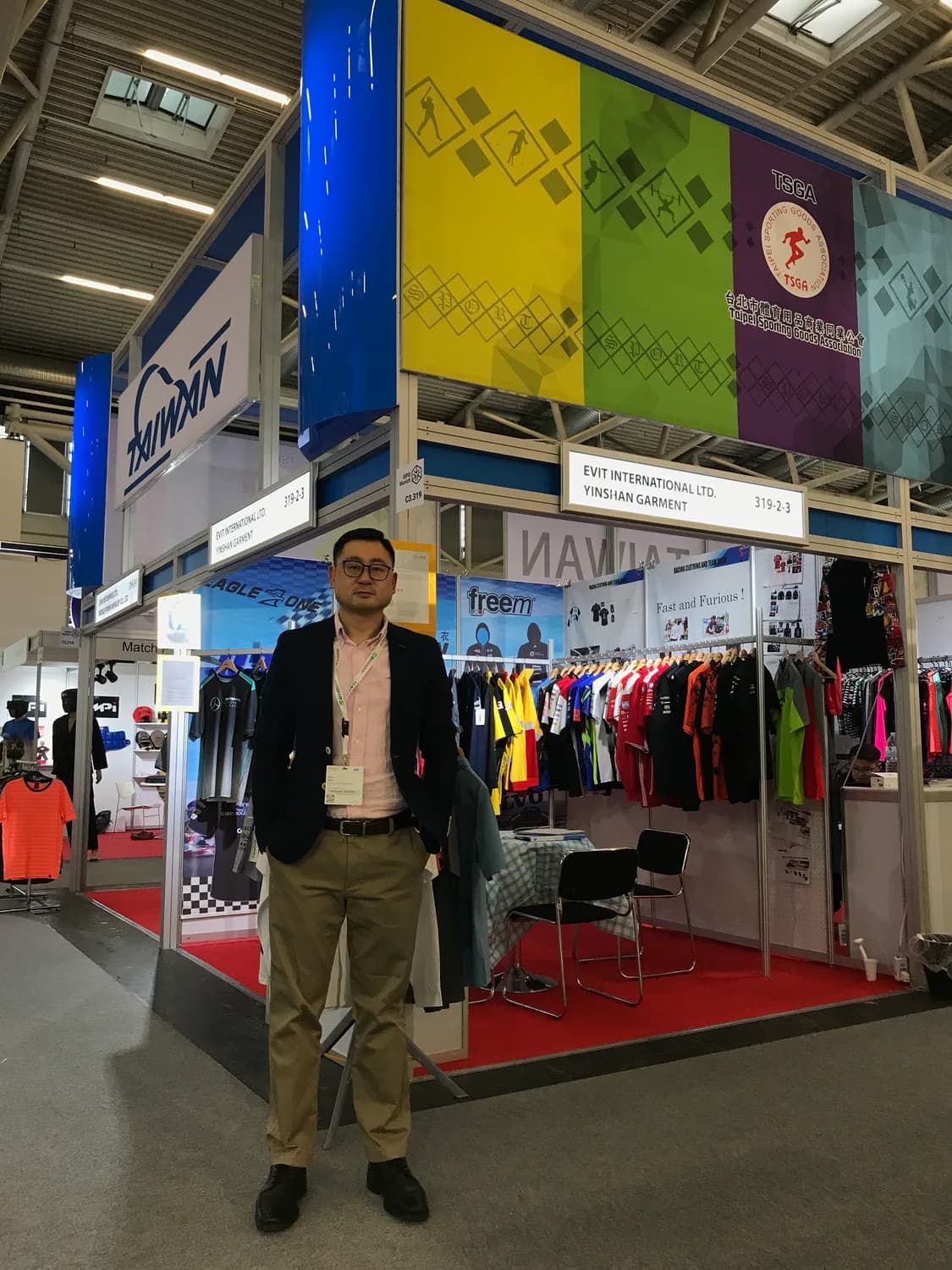 Yinshan Garments exhibition booth with sportswear samples on display