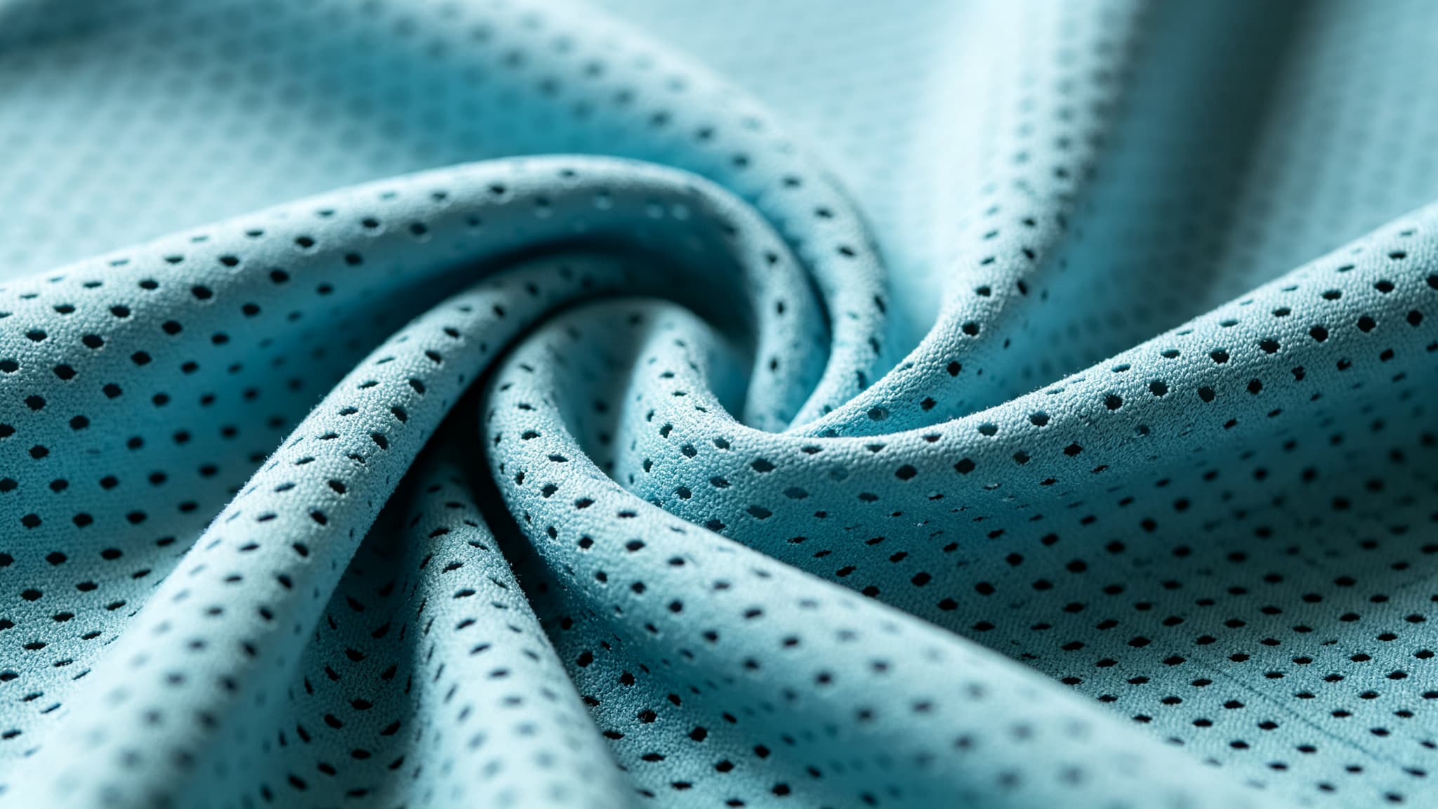 Perforated activewear fabric shown as a material-direction reference for a yoga jumpsuit sample discussion
