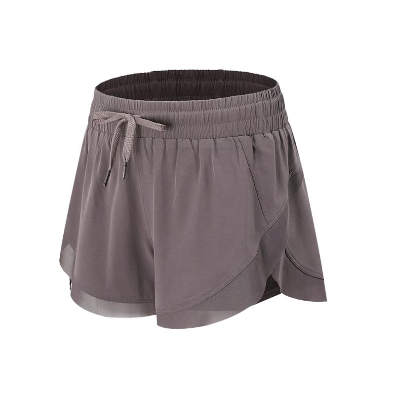 Layered two-in-one training shorts with an outer overlap panel and inner short view 2