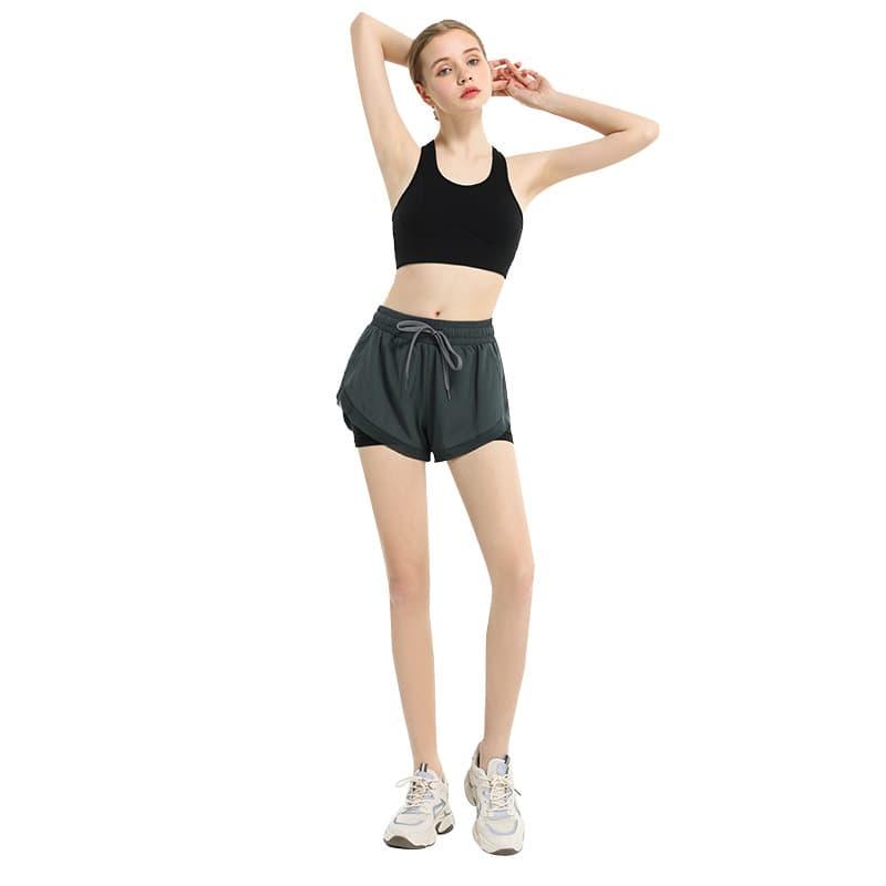Layered two-in-one training shorts with an outer overlap panel and inner short view 5