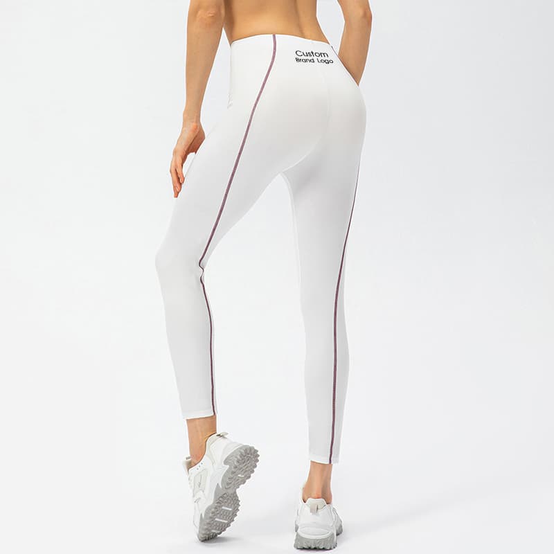 High-waist training leggings with contrast piping along the side leg view 3