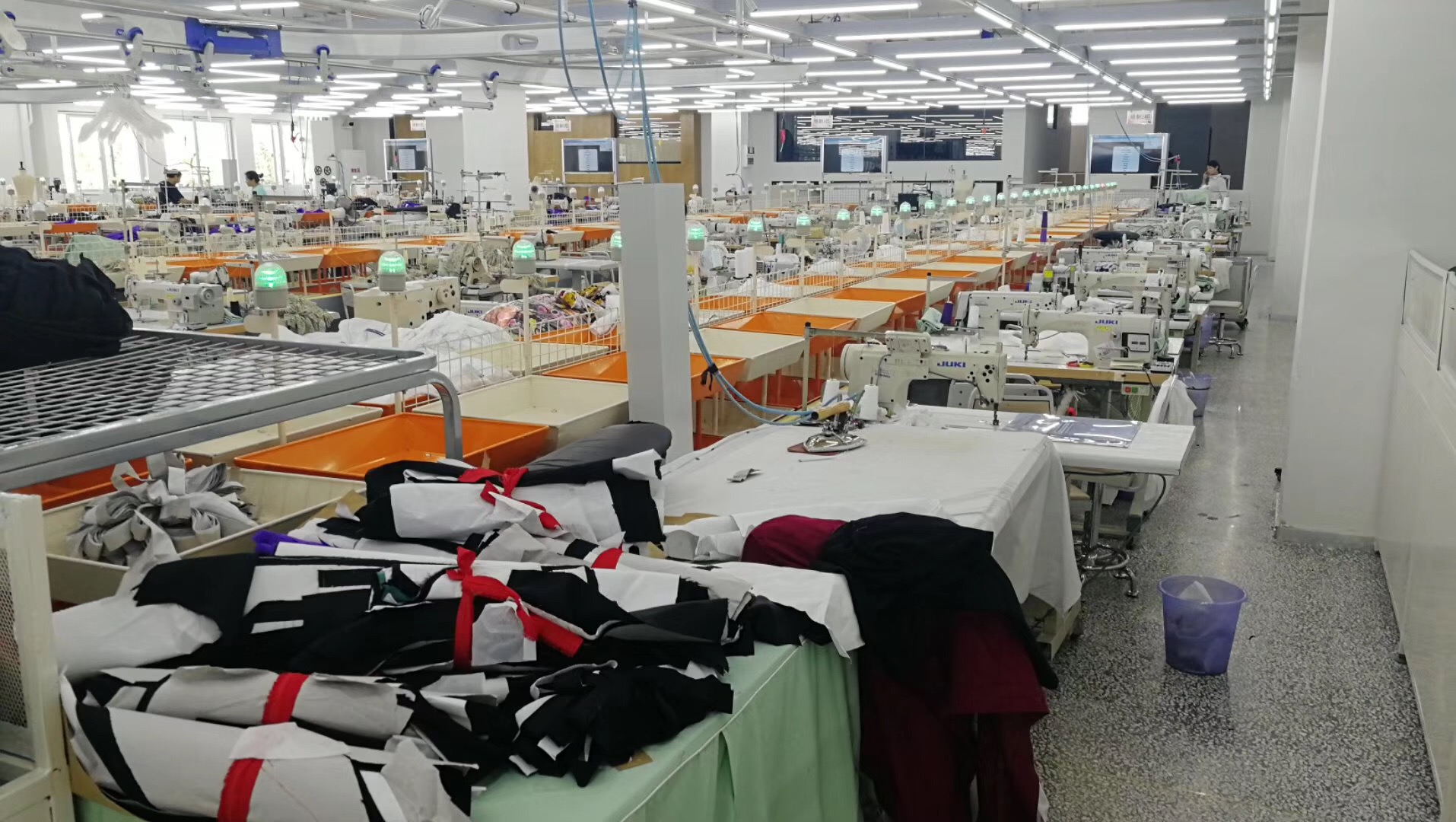 Ningbo garment factory sewing floor with organised workstations and garment production groups