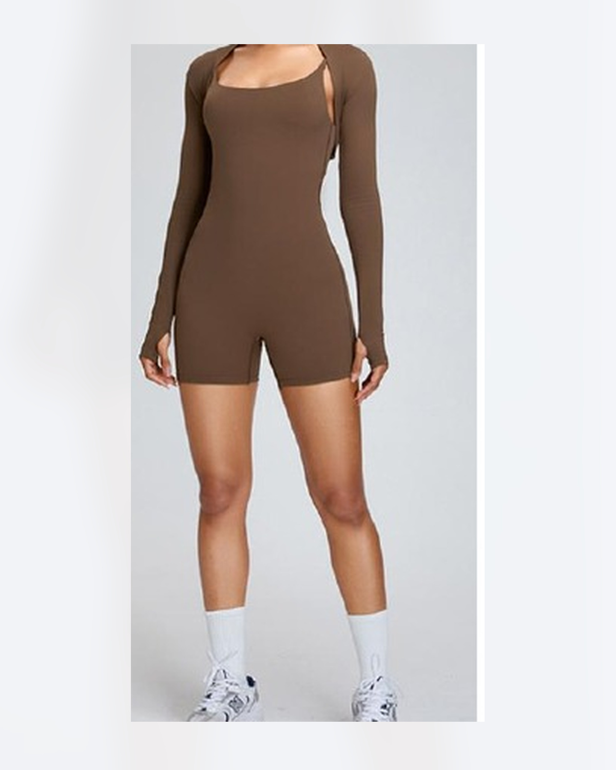 Unbranded brown long-sleeve activewear romper used as a product-shape reference for a custom development discussion.