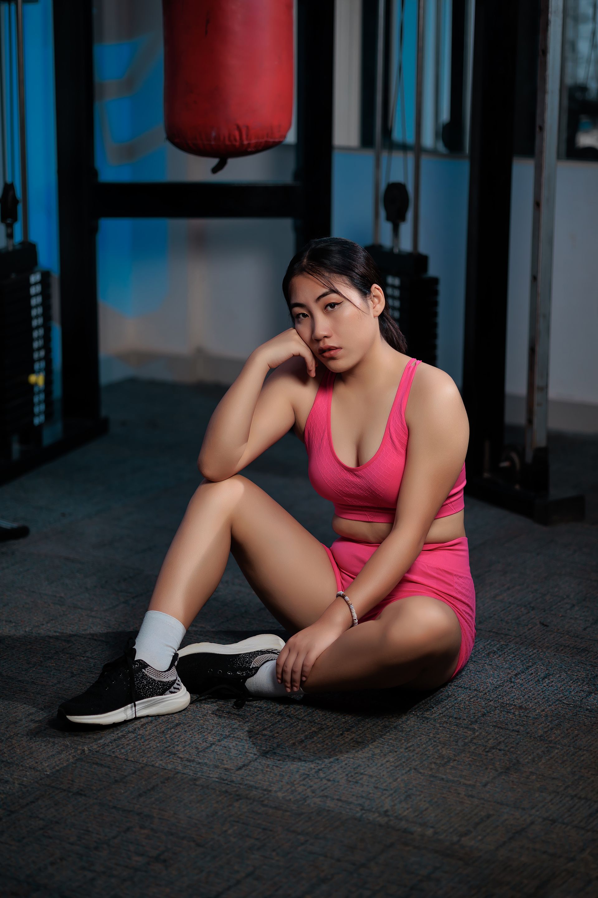 User-provided editorial reference of an unbranded pink activewear set in a gym setting, illustrating a gym-programme product-direction discussion rather than an inPACE product record