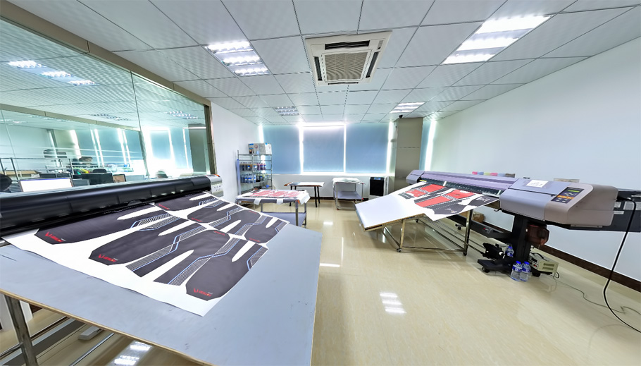 Printed garment panels arranged on a textile printing workspace