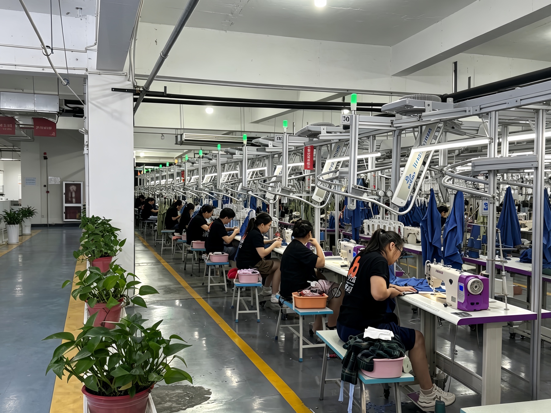 Real garment factory sewing line used for activewear seam construction and sample review
